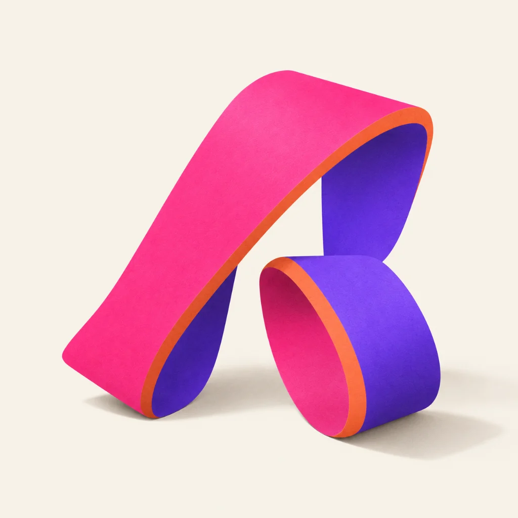 A thick paper ribbon folded into a loose letterform in magenta and violet with a coral edge